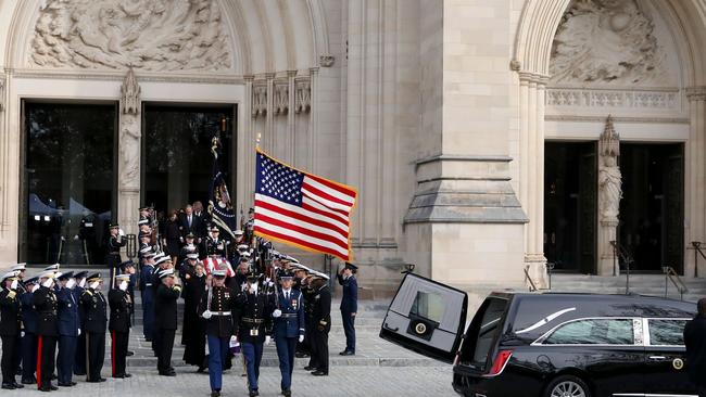 The flag-draped coffin of George H.W. Bush departs the National Cathedral following the state funeral. Picture: AFP.