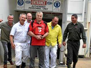 Dave Carroll in the centre holding the defibrillator, with the men who saved his life- Darren Grimston, Darrell Schultz, Jason Keep, Luke Murphy and Steve Formaggian outside the boning room at Casino's NCMC. Picture: Susanna Freymark