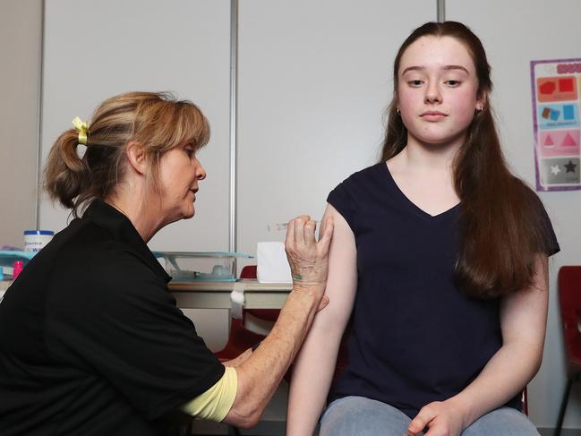 Tara Jones receives a meningococcal vaccination from nurse Mary Coad. Picture: NIKKI DAVIS-JONES