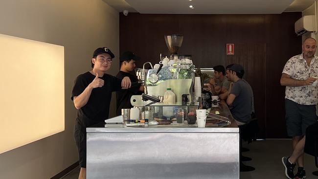 Samuel Lee (l) pictured at his Crows Nest coffee shop.