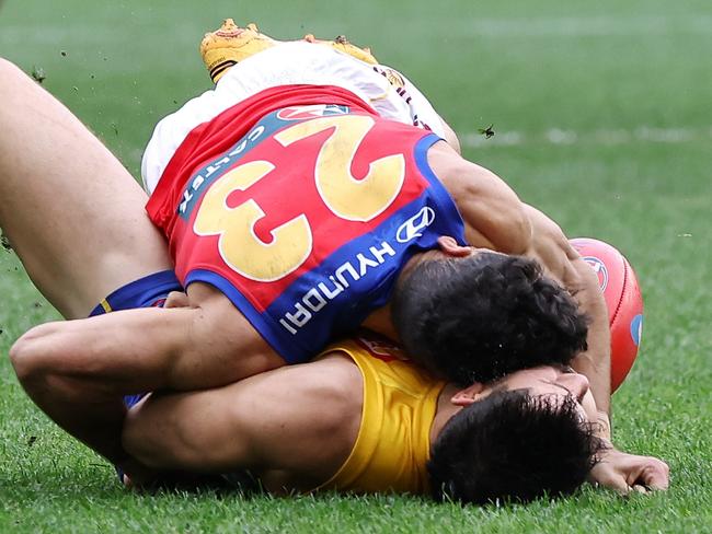 PERTH, AUSTRALIA – JULY 14: Liam Duggan of the Eagles lies concussed tackled by Charlie Cameron of the Lions during the 2024 AFL Round 18 match between the West Coast Eagles and the Brisbane Lions at Optus Stadium on July 14, 2024 in Perth, Australia. (Photo by Will Russell/AFL Photos via Getty Images)