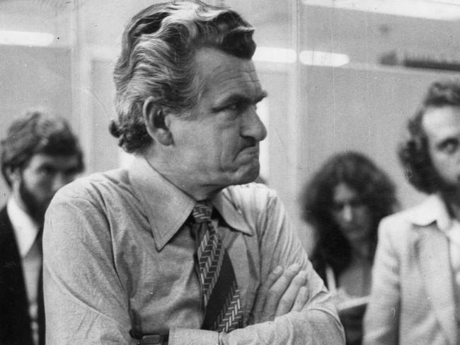 Bob Hawke arms crossed and looking unhappy in 1977.