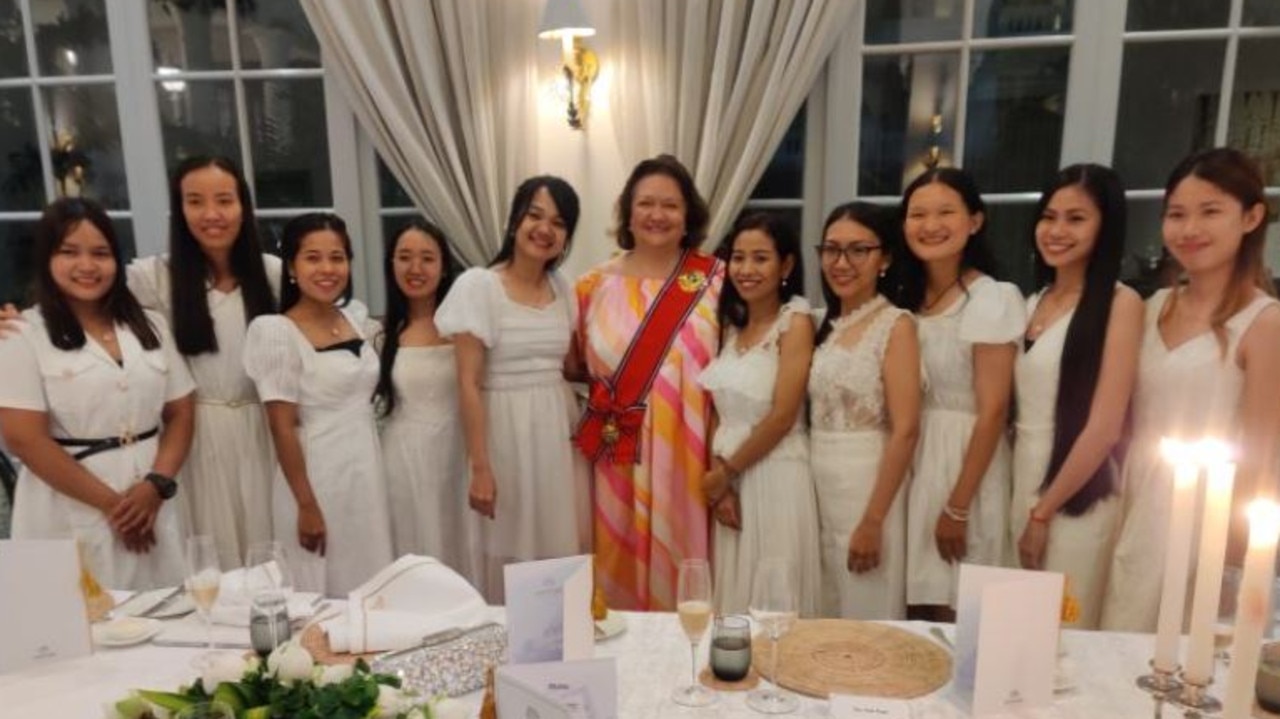 Gina Rinehart was pictured wearing a red sash alongside a group of young women. Picture: Gina Rinehart