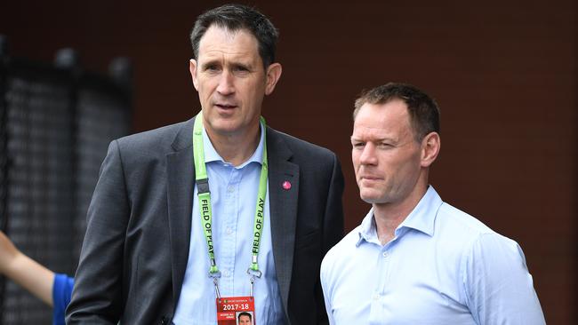 Howard (L) was at times a polarising figure in cricket. (AAP Image/Dave Hunt)