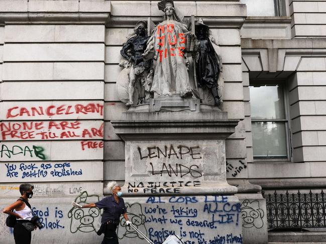 Graffiti marks a historic building near where protesters congregated in a park outside of City Hall in Lower Manhattan. Picture: AFP