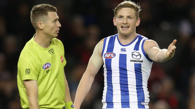 AFL Round 15. 01/07/2018.   Essendon v North Melbourne at Etihad Stadium.  North Melbourne's Jack Ziebell talks with the umpire after giving away a free kick  . Pic: Michael Klein