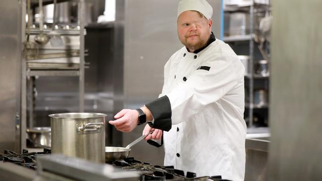 Chef Craig Shanahan cooking in the TAFE kitchen. Picture: Angelo Velardo