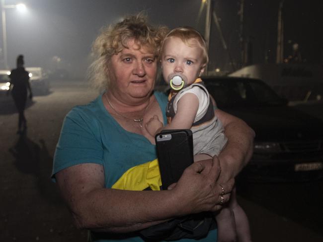 Joy-Anne McGovern taking her grandson Travis to a tugboat. Picture: Gary Ramage