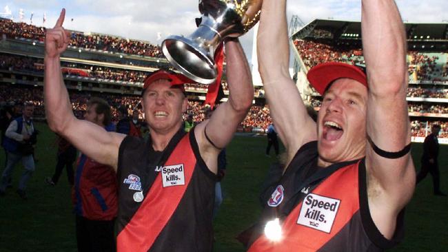 Paul Barnard and Darren Bewick celebrate Essendon’s 2000 flag.