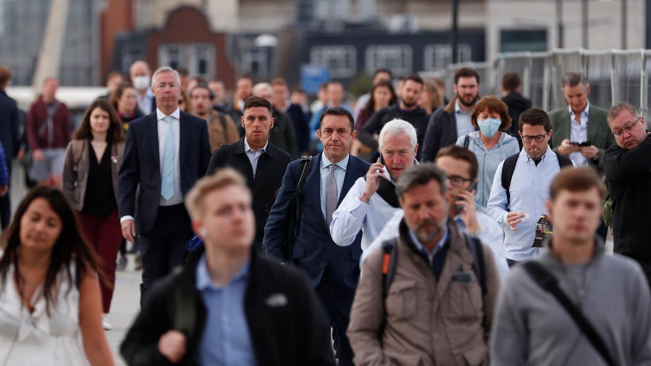 Commuters on London Bridge in England where gathering restrictions will change from Monday, September 14. Picture: Adrian Dennis/AFP