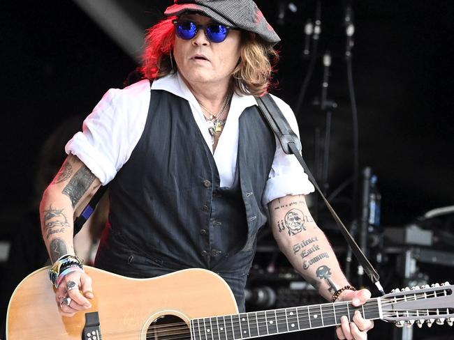 Johnny Depp performs on stage with Jeff Beck during the Helsinki Blues Festival. Picture: Jussi Nukari / Lehtikuva / AFP / Finland OUT