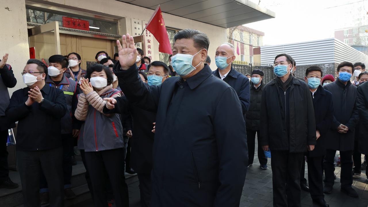 People clapped behind him as he wave during the appearance. Picture: AP/Xinhua/Pang Xinglei