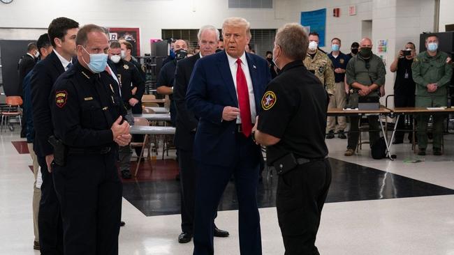 Donald Trump with police officers in Kenosha. Picture: AP.