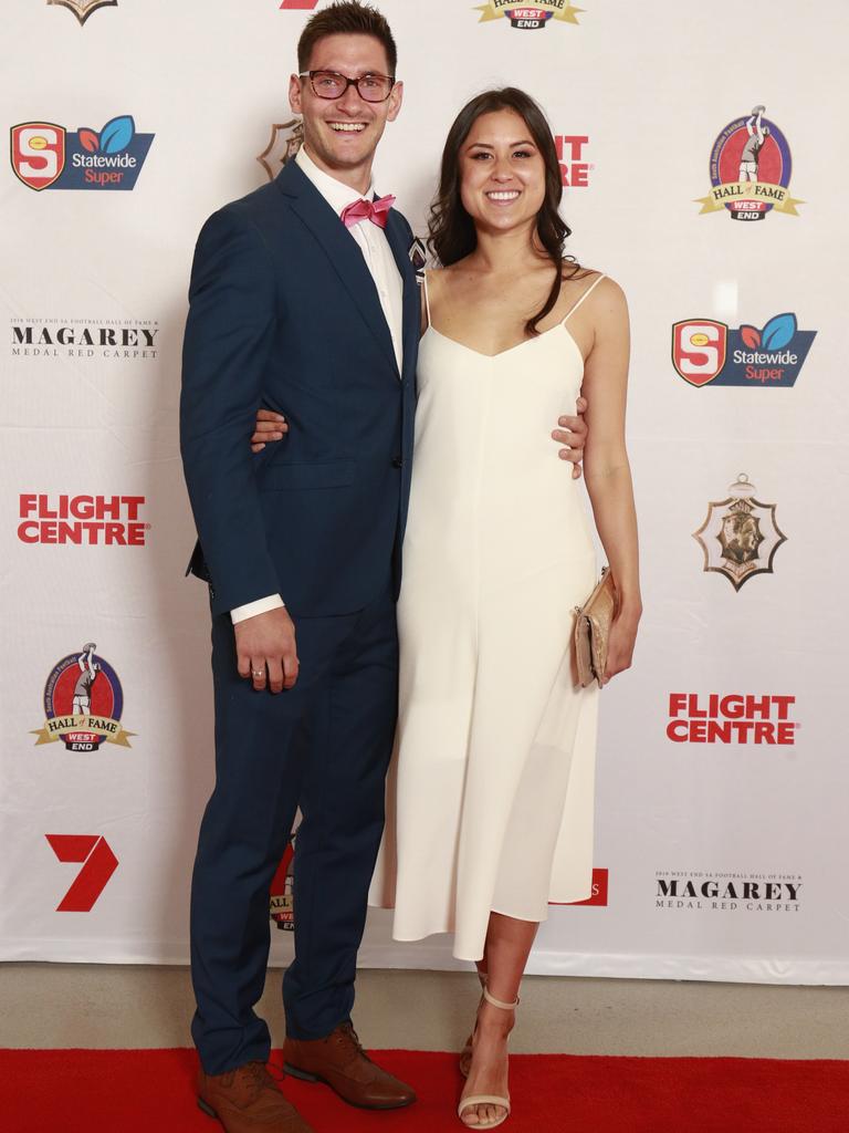 Aidan Tropeano and Alexandra Tropeano, wearing Bec and Bridge, pose for a picture on the red carpet at Adelaide Oval in North Adelaide, for the Magarey Medal, Monday, September 9, 2019. Picture: Matt Loxton