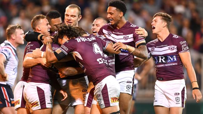 Manly players celebrate a try against the Roosters. Picture; NRL Photos