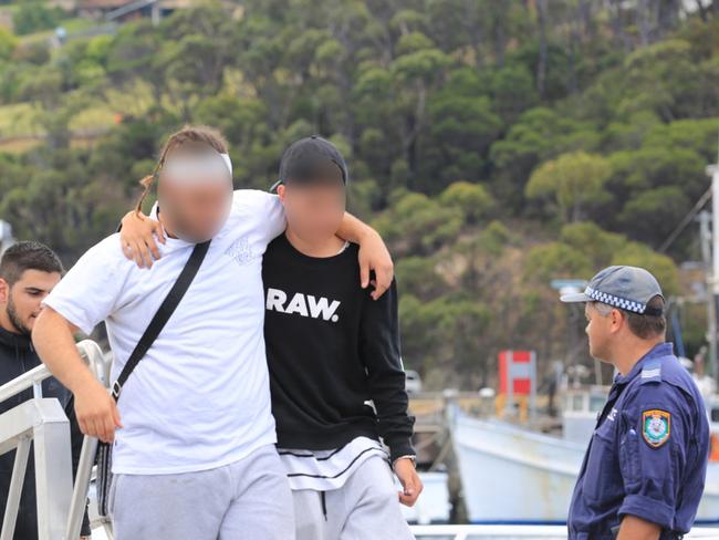 A bandaged passenger from the Carnival Legend cruise ship in Eden, NSW.