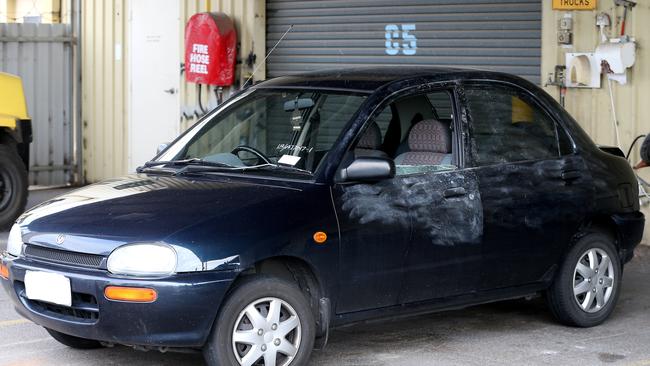 The Mazda sedan the teen victims had been travelling in when they were rammed and robbed. Photo: Calum Robertson.