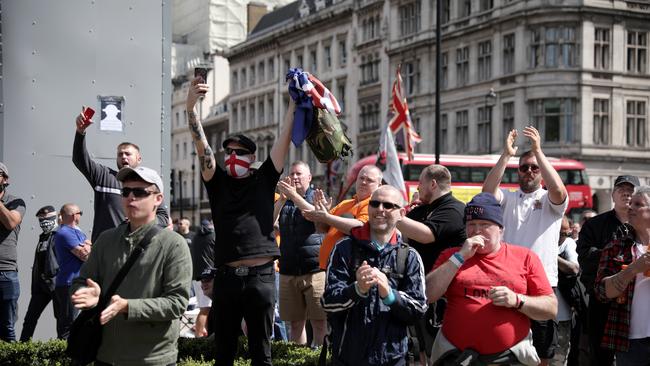 A group gathers around the Churchill statue. Picture: Getty