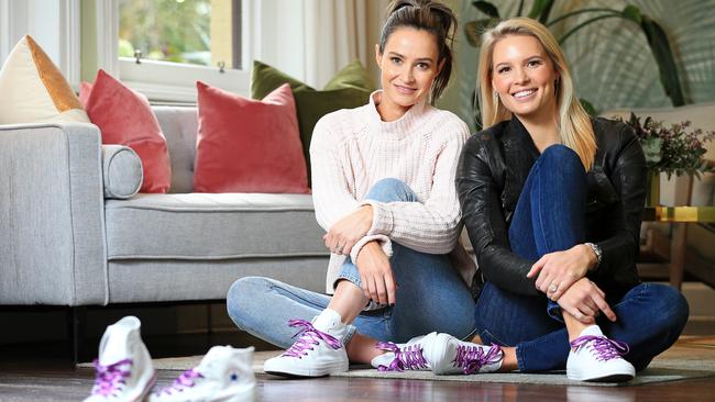 Kylie Brown and Catherine Riewoldt modelling the Converse range of sneakers to raise money for the Maddie Riewoldt's Vision charity. Picture: Mark Stewart