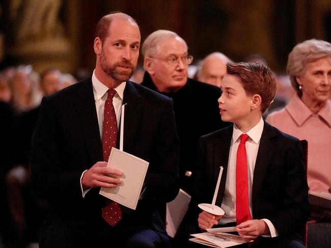 Prince William and Prince George share a moment at the concert. Picture: Getty Images