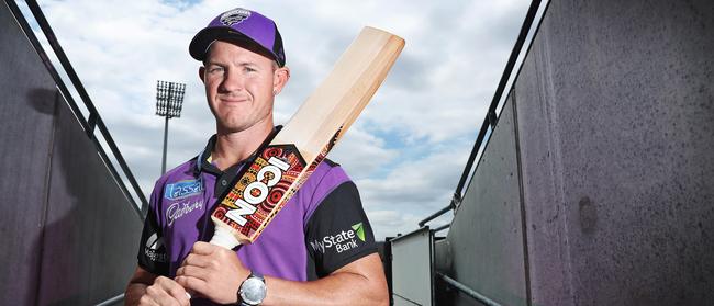 Hobart Hurricanes D'Arcy Short with a custom bat featuring artwork created by Indigenous artist Marcus McGregor Cassady. Picture: LUKE BOWDEN