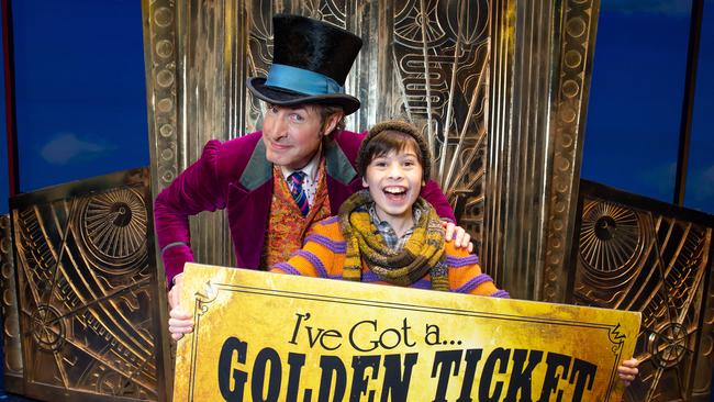 Willy Wonka (Paul Slade Smith) and Charlie (Lachlan Young) with a golden ticket in a previous Charlie and the Chocolate Factory musical production. Picture: Sarah Matray