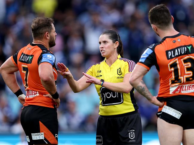 SYDNEY, AUSTRALIA - MAY 04: Referee, Kasey Badger speaks with Aidan Sezer of the Tigers during the round nine NRL match between Canterbury Bulldogs and Wests Tigers at Accor Stadium, on May 04, 2024, in Sydney, Australia. (Photo by Brendon Thorne/Getty Images)