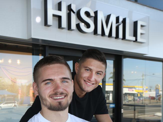 Gold Coast millionare businessmen Alex Tomic (in white) and Nik Mirkovic  at their Mermaid Beach offic, a part of their success story. Picture Glenn Hampson