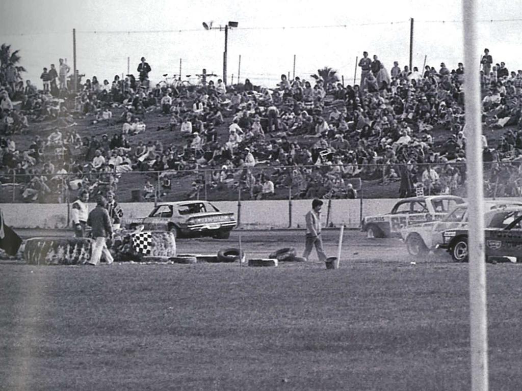 The year is 1978 and sedans line up on main straight prior to race commencement.