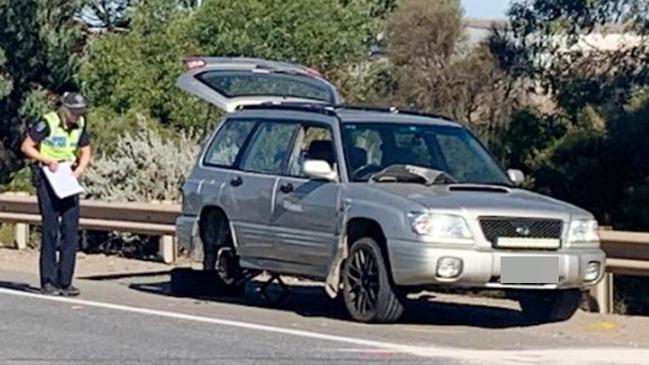 Police major crash investigators at the scene of an accident where a person was changing a tyre on the side of the Port Expressway at Wingfield when they were hit by a car. Picture: George Yankovich