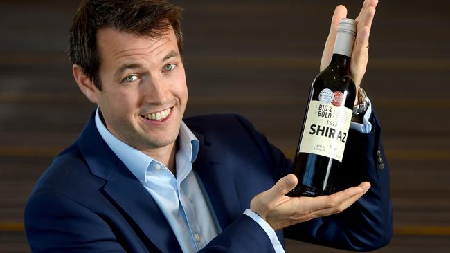 Coles group wine buyer Ed Ashley holds up the award-winning $5 plonk. Picture: Sam Wundke