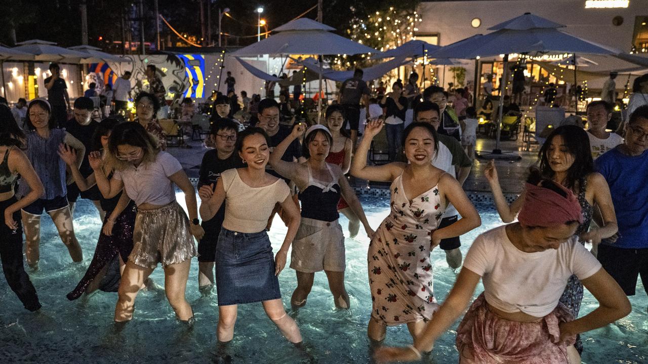 People cool off as they dance in a swimming pool in an event at a local restaurant during a heatwave in Beijing, China. Picture: Getty Images