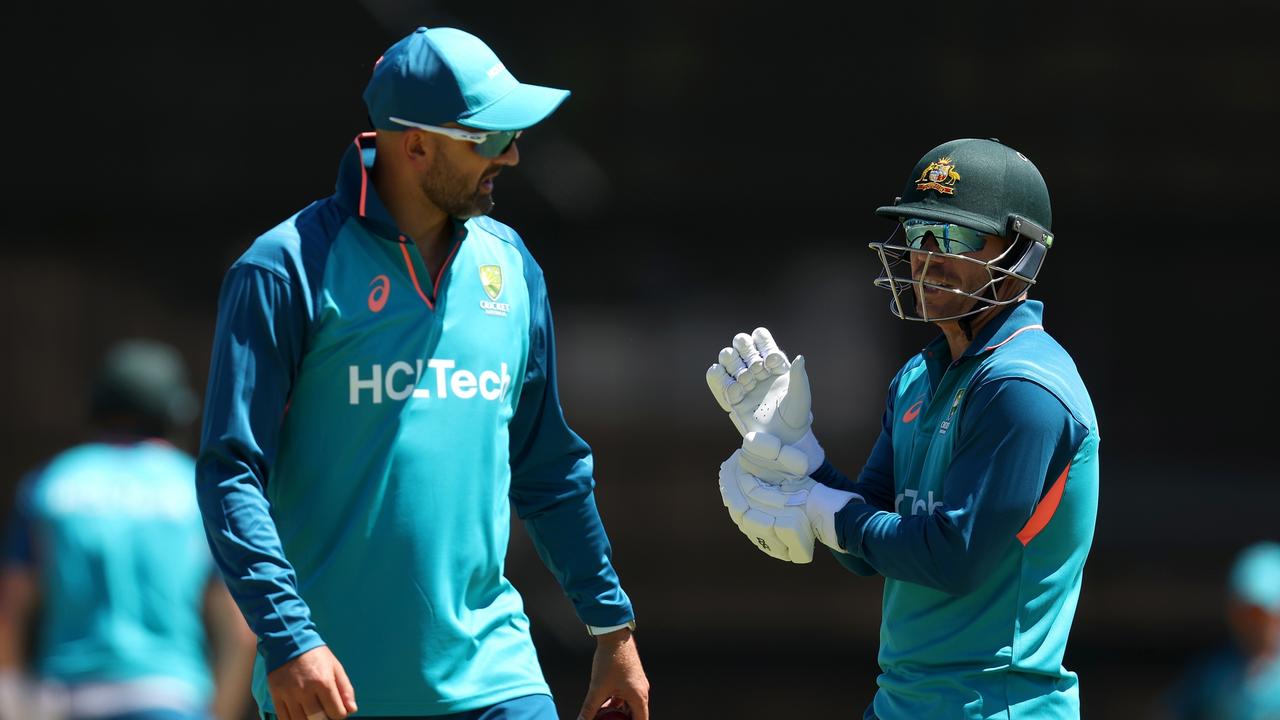 David Warner talks with Nathan Lyon at training. (Photo by Paul Kane/Getty Images)