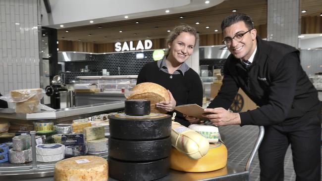 Foodland employees, Anthony Trimboli, and Amelia Romaldi, work on getting the place shipshape for the big opening. Picture: Dean Martin