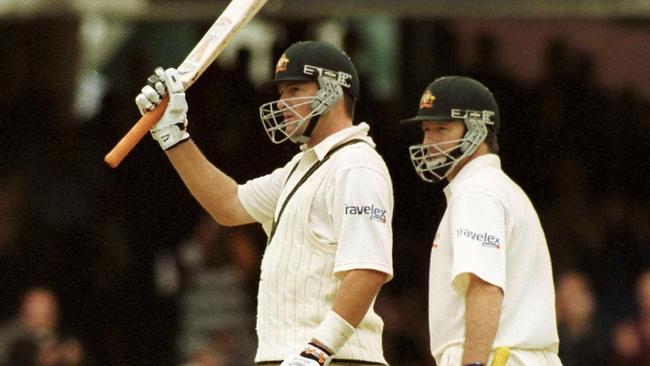 Australia's Mark Waugh (l) celebrates his century with Steve Waugh at his right hand side in their hey day.