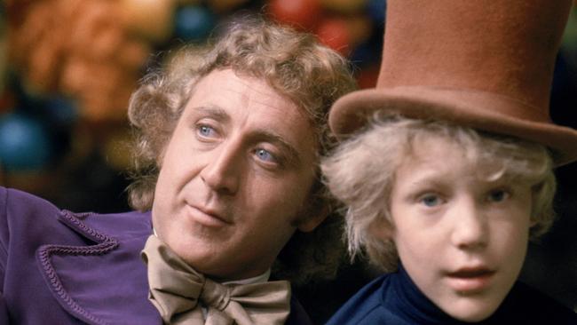 Gene Wilder as Willy Wonka and Peter Ostrum as Charlie Bucket, wearing Wonka's top hat.