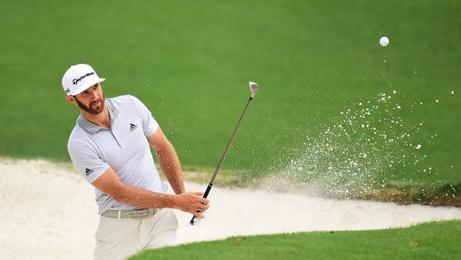 AUGUSTA, GA - APRIL 05: Dustin Johnson of the United States plays a shot from a bunker on the tenth hole during a practice round prior to the start of the 2017 Masters Tournament at Augusta National Golf Club on April 5, 2017 in Augusta, Georgia. (Photo by Harry How/Getty Images)