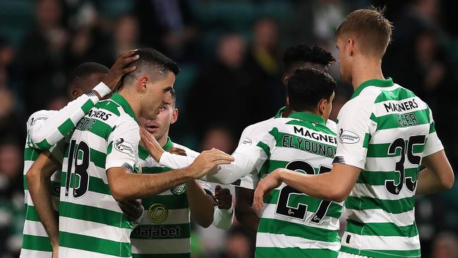 Celtic players congratulate Tom Rogic, second left, after he scored against Partick Thistle Picture: Getty Images