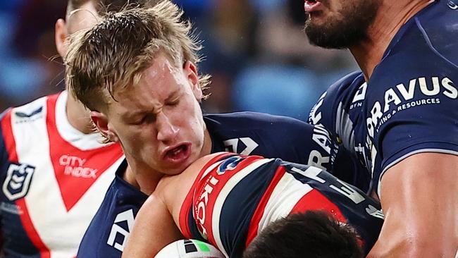 SYDNEY, AUSTRALIA - JUNE 02: Joseph Manu of the Roosters is tackled by Jaxon Purdue and Jordan McLean  of the Cowboys during the round 13 NRL match between Sydney Roosters and North Queensland Cowboys at Allianz Stadium, on June 02, 2024, in Sydney, Australia. (Photo by Jeremy Ng/Getty Images)