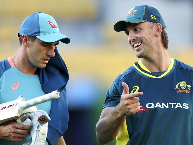 WELLINGTON, NEW ZEALAND - FEBRUARY 21: Pat Cummins (L) and Mitchell Marsh of Australia talk during game one of the Men's T20 International series between New Zealand and Australia at Sky Stadium on February 21, 2024 in Wellington, New Zealand. (Photo by Hagen Hopkins/Getty Images)