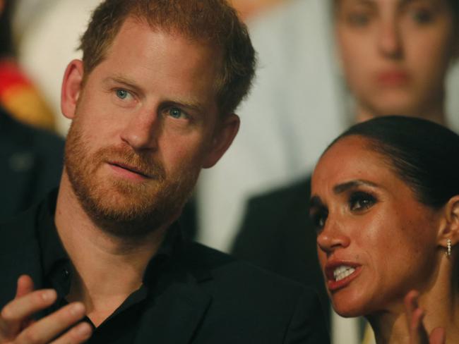 Harry, Duke of Sussex and patron of the Invictus Games (L), and his wife Meghan, Duchess of Sussex, attend the closing ceremony of the 2023 Invictus Games in Duesseldorf, western Germany on September 16, 2023. The Invictus Games, an international sports competition for wounded soldiers founded by British royal Prince Harry in 2014, was taking place from September 9 to 16, 2023 in Duesseldorf. (Photo by LEON KUEGELER / AFP)