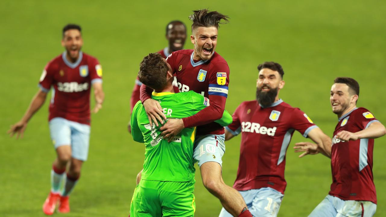 Aston Villa players celebrate winning the penalty shootout