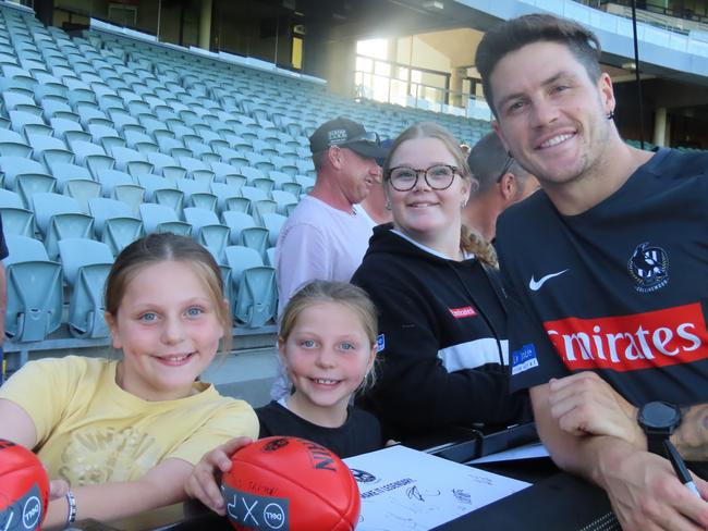 Addison, Ebony and also Halli Dalton with Collingwood player Jack Crisp. Picture: Jon Tuxworth