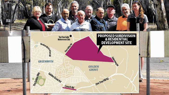 Tea Tree Gully mayoral candidate Cr Paul Barbaro (third from left) with residents campaigning to have Crouch Rd reopened and a map showing the land his family wanted to sell. PICTURE: Sam Wundke/AAP