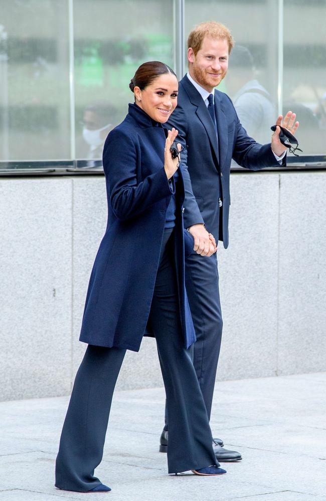 Meghan and Harry removed their masks outdoors for the photo. Picture: AFP