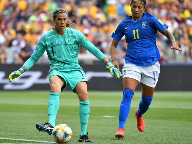 Lydia Williams plays a pass against Brazil. Picture: AFP