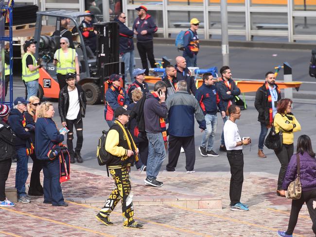 Football fans watch on after the Grand Final Day incident. Picture: Tony Gough