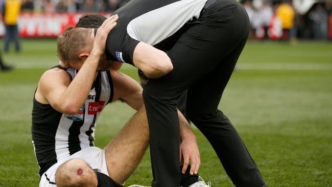 Nathan Buckley and Brodie Grundy embrace