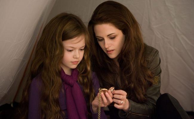 The real life infidelity of actor Kristen Stewart, pictured with Mackenzie Foy who plays her daughter in the final instalment of the Twilight saga, may have harmed cinema ticket sales in Hervey Bay. Picture: Andrew Cooper