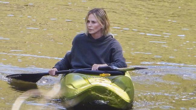 Action-woman Charlize Theron paddles a kayak, as she takes to the Australian waters for her new movie. Picture: Media Mode